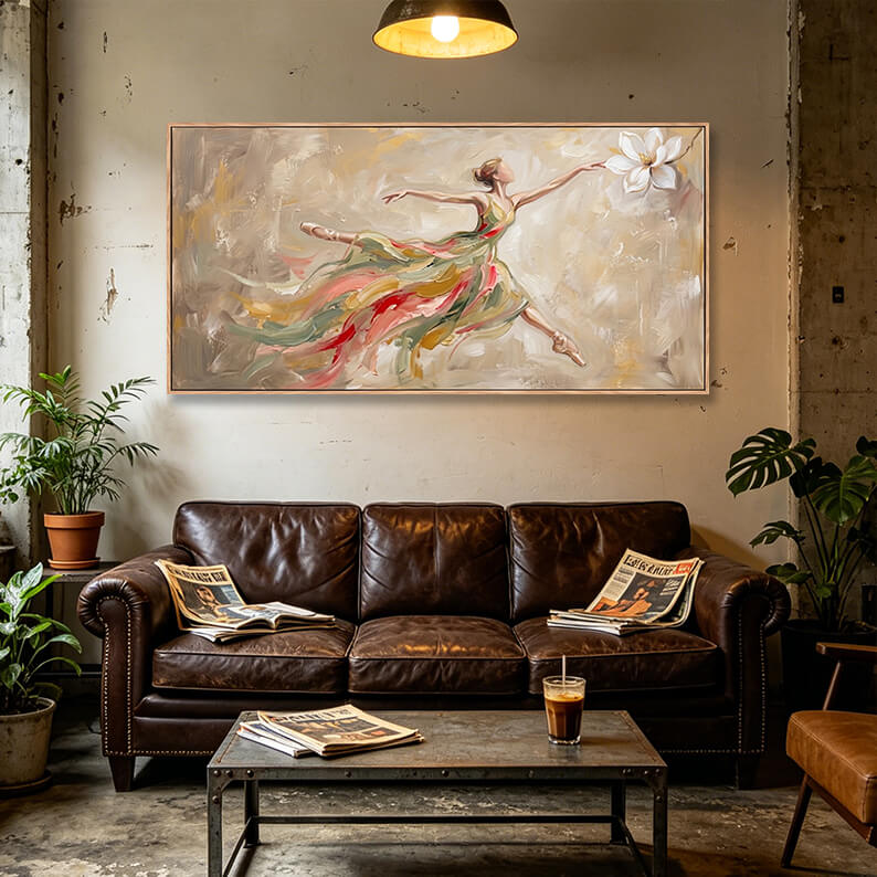 Elegant hand-painted ballerina dancer canvas hanging on a textured wall above a vintage brown leather sofa