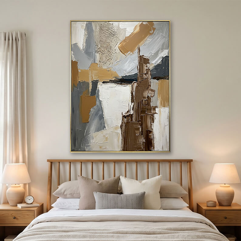 Grey and brown abstract painting hanging over a wooden bed in a bright modern bedroom.