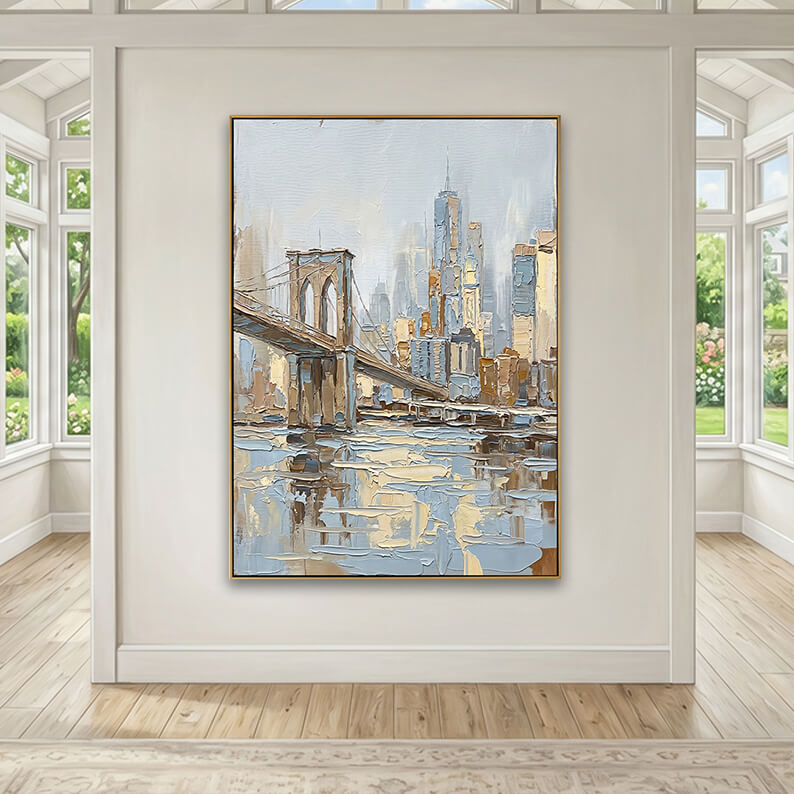 An airy, sunlit room mockup with the gold-framed cityscape painting centered on a neutral feature wall. The wall is flanked on both sides by large multi-pane windows looking out onto a lush green garden. Light wood flooring and the edge of a vintage-style area rug complete the bright, spacious look.