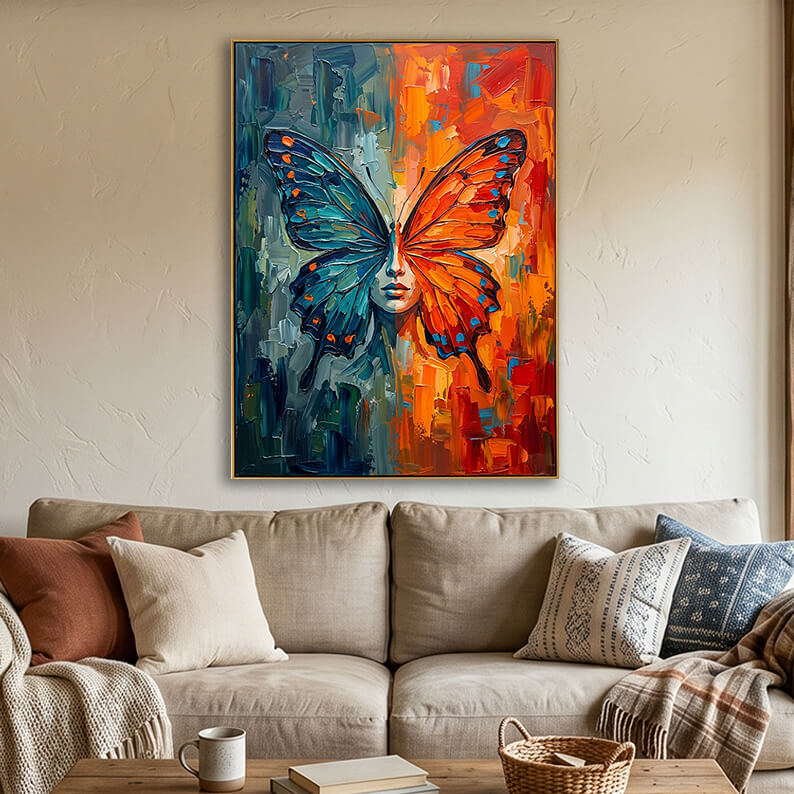 Textured hand-painted butterfly and woman's face painting hanging over a brown couch with decorative pillows in a contemporary living room.