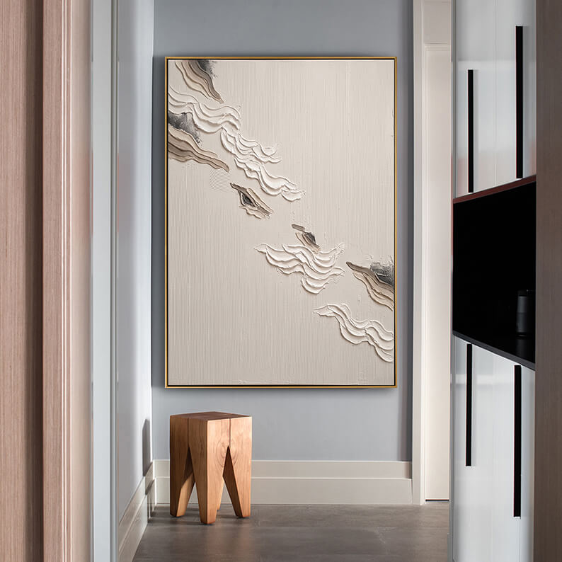 Contemporary heavy texture canvas painting styled in a minimalist modern corridor with a geometric wooden stool.