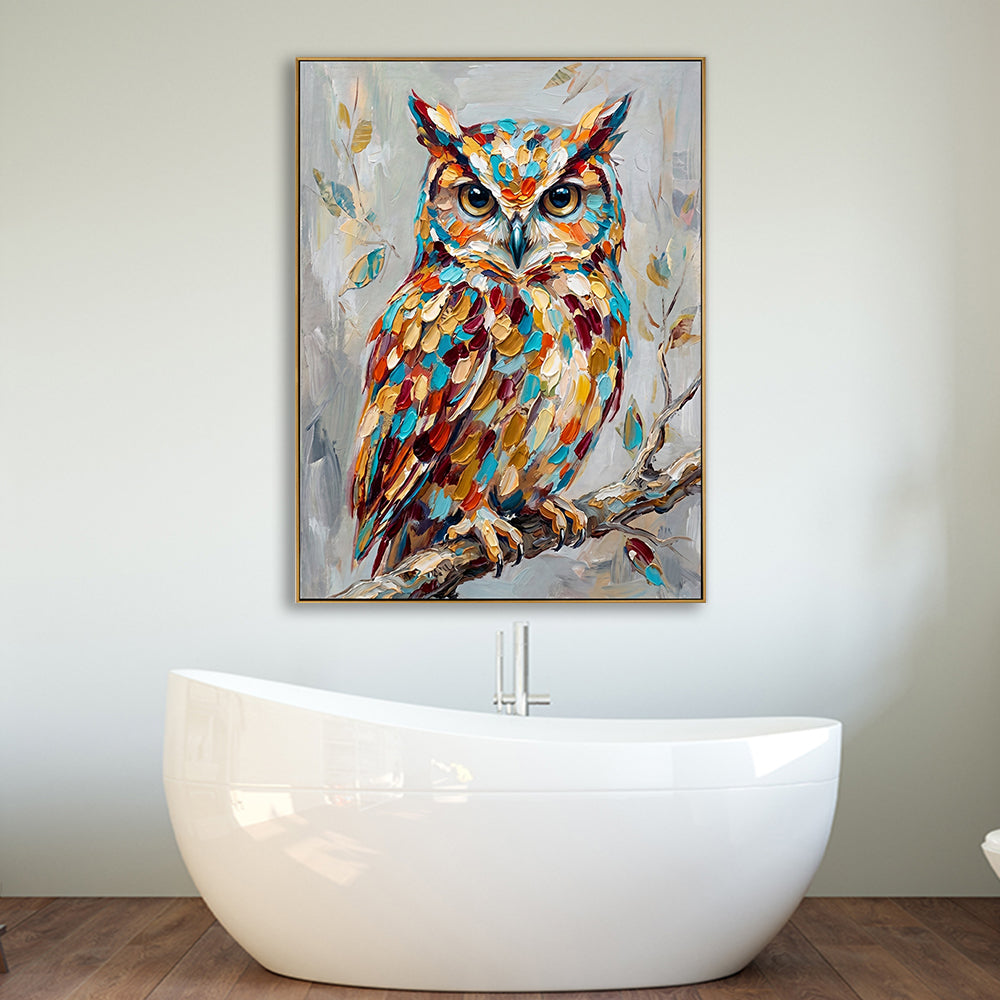 Unique bathroom decor featuring a hand-painted owl canvas positioned above a modern white bathtub.