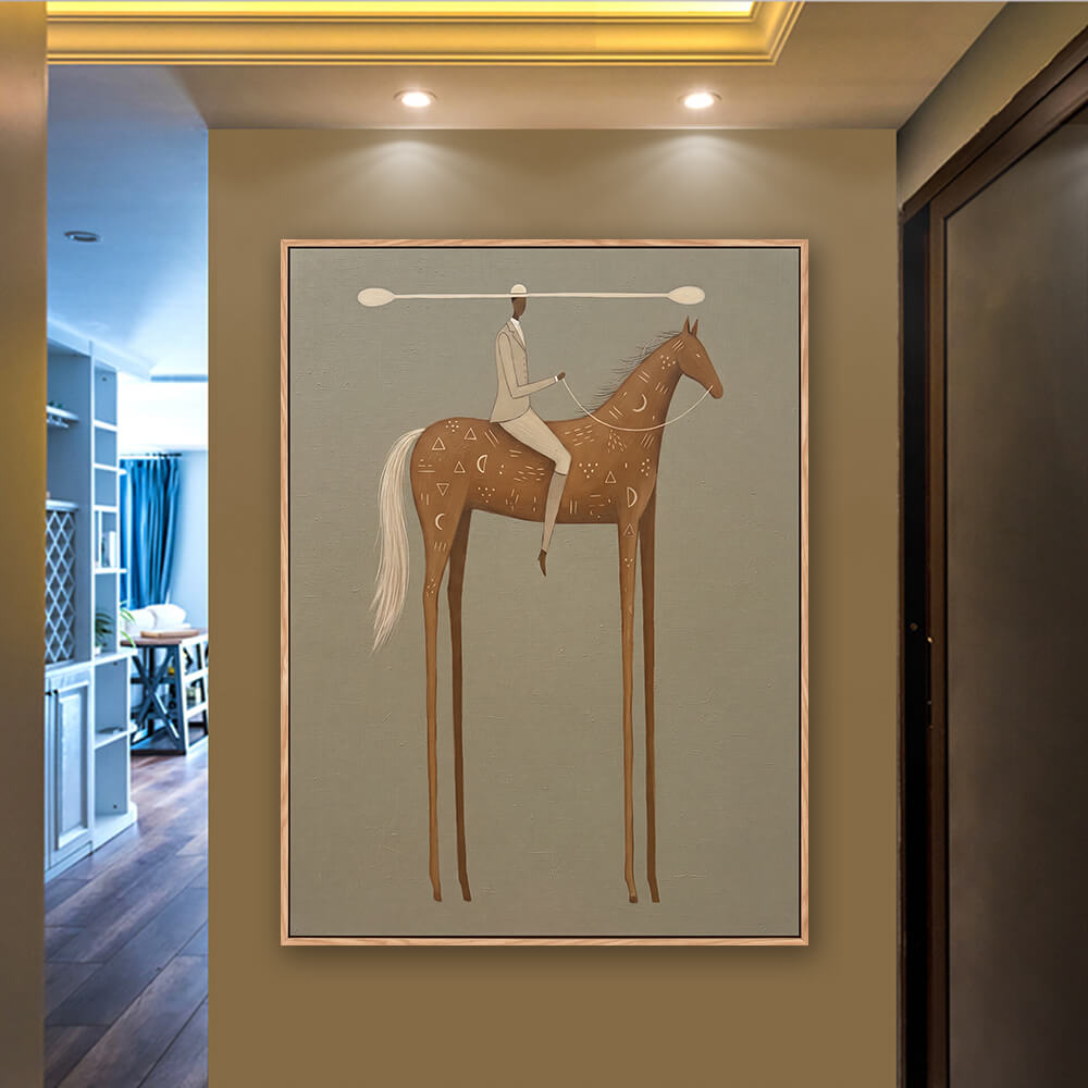 Square surreal rider artwork hung in entryway beside upholstered accent chair