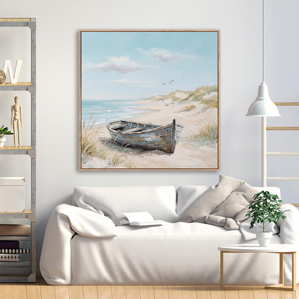 Textured beach landscape painting with wooden boat above white sofa in modern living room