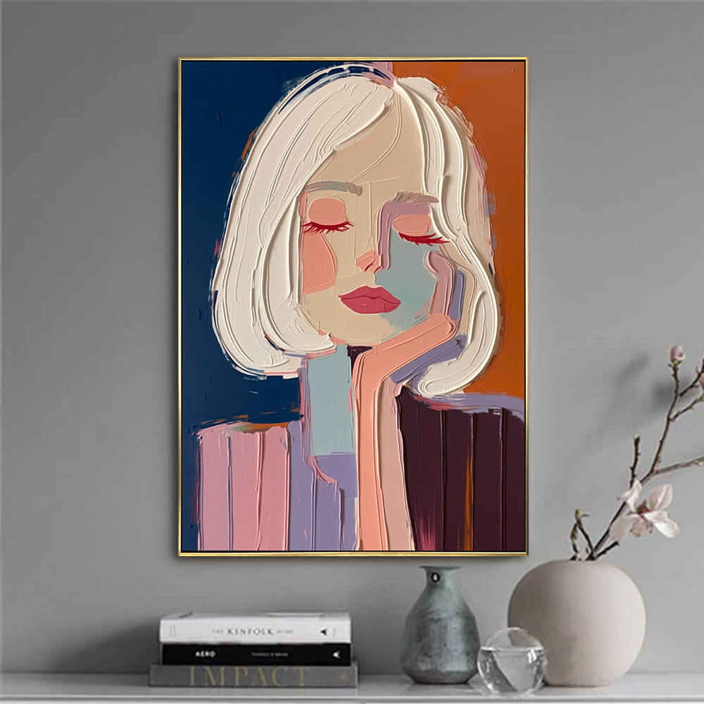 Hand-painted modern art canvas featuring a stylish female portrait styled on a gray accent wall with modern decor books.