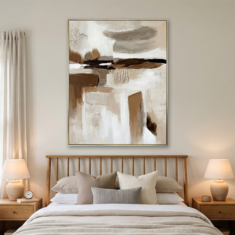 Beige and brown abstract painting hanging over a wooden bed in a bright modern bedroom.