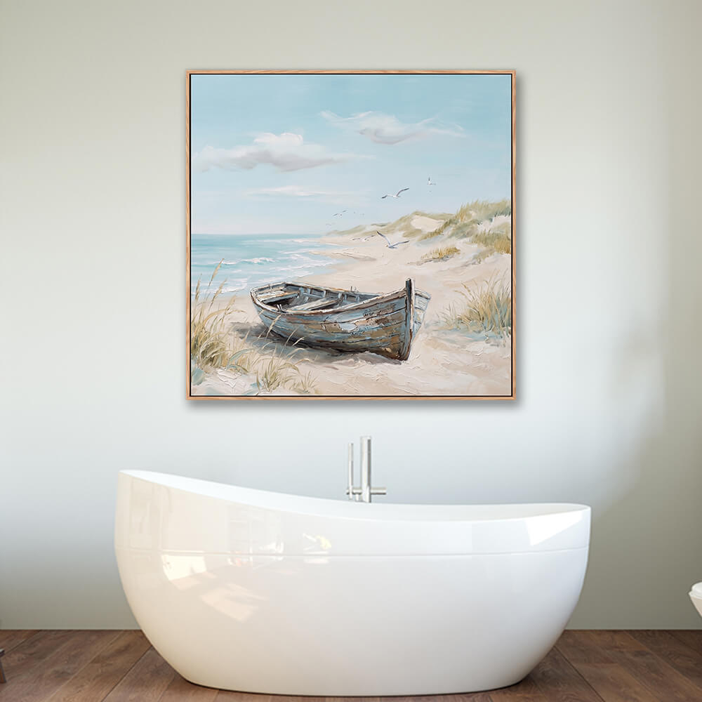 Framed vintage boat beach landscape painting above bathtub in modern bathroom