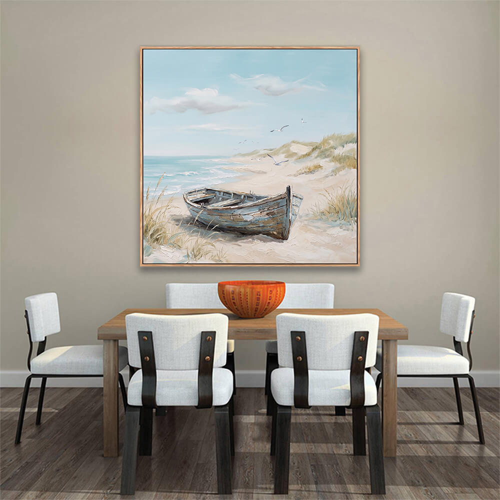 Hand painted vintage boat beach scene artwork above wooden dining table