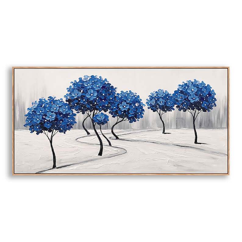 Close-up of a hand-painted palette knife abstract landscape canvas featuring heavily textured, spherical cobalt blue trees on an off-white snowy ground.