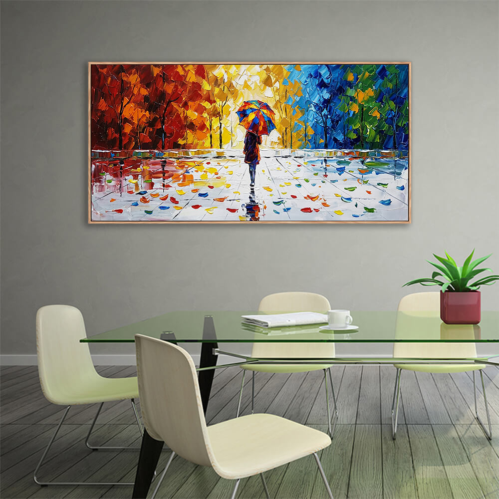 Richly textured autumn forest landscape artwork hanging in a contemporary dining area featuring a green glass dining table.