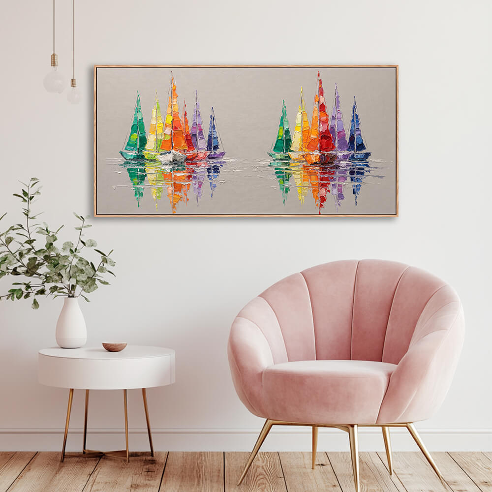 Horizontal rainbow sailboat painting decorating wall beside velvet accent chair