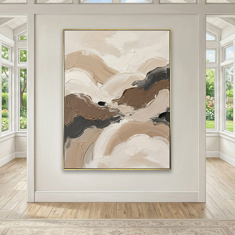 Beige and grey heavily textured abstract canvas art styled above a beige fabric sofa in a neutral living room.