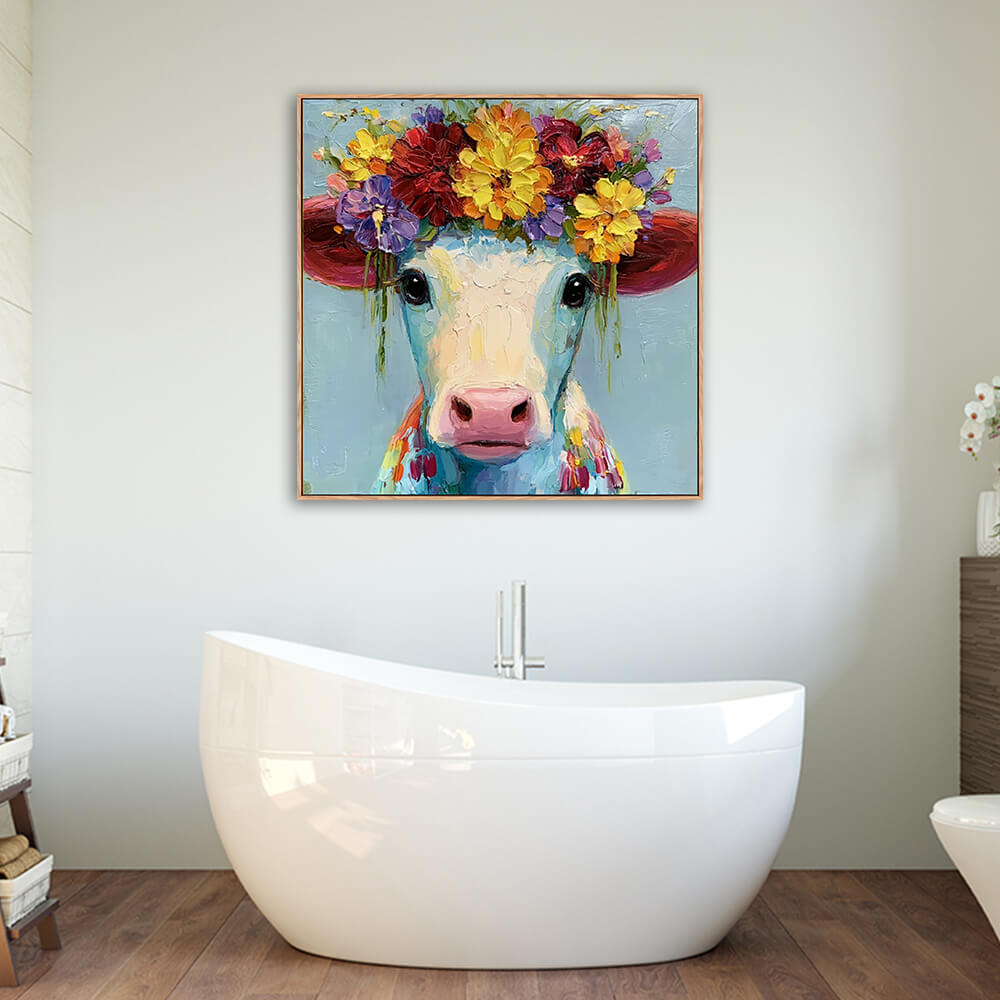 Flower crown cow portrait canvas mounted above freestanding white oval bathtub in warm wood farmhouse bathroom
