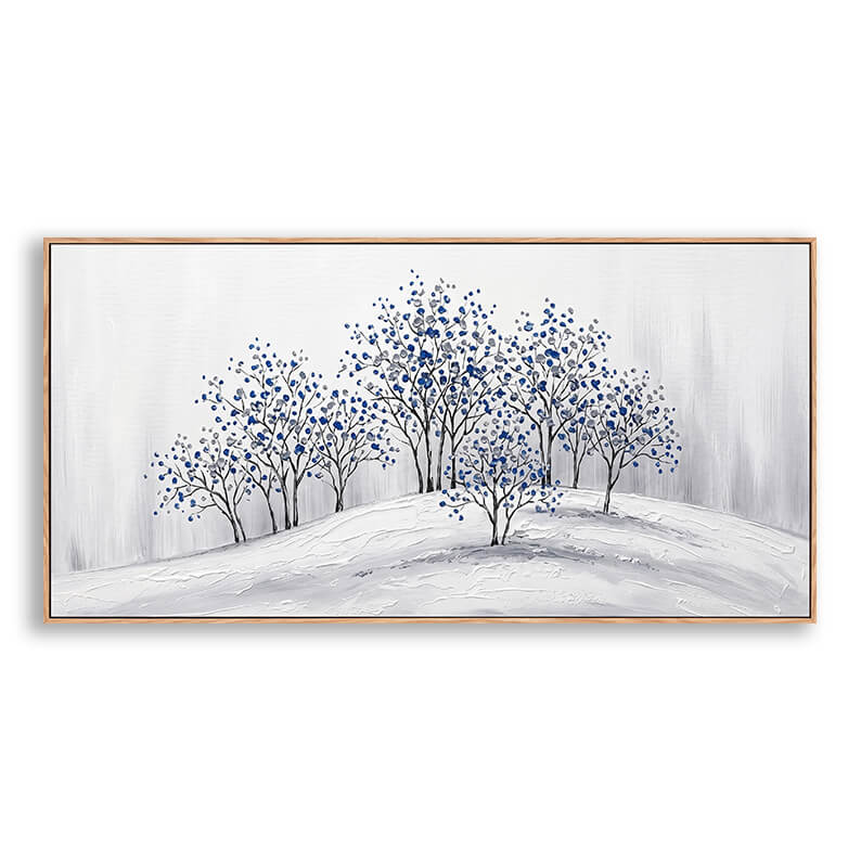 Close-up of a hand-painted palette knife landscape painting showing delicate cobalt blue blossoms on minimalist winter trees over textured snow.