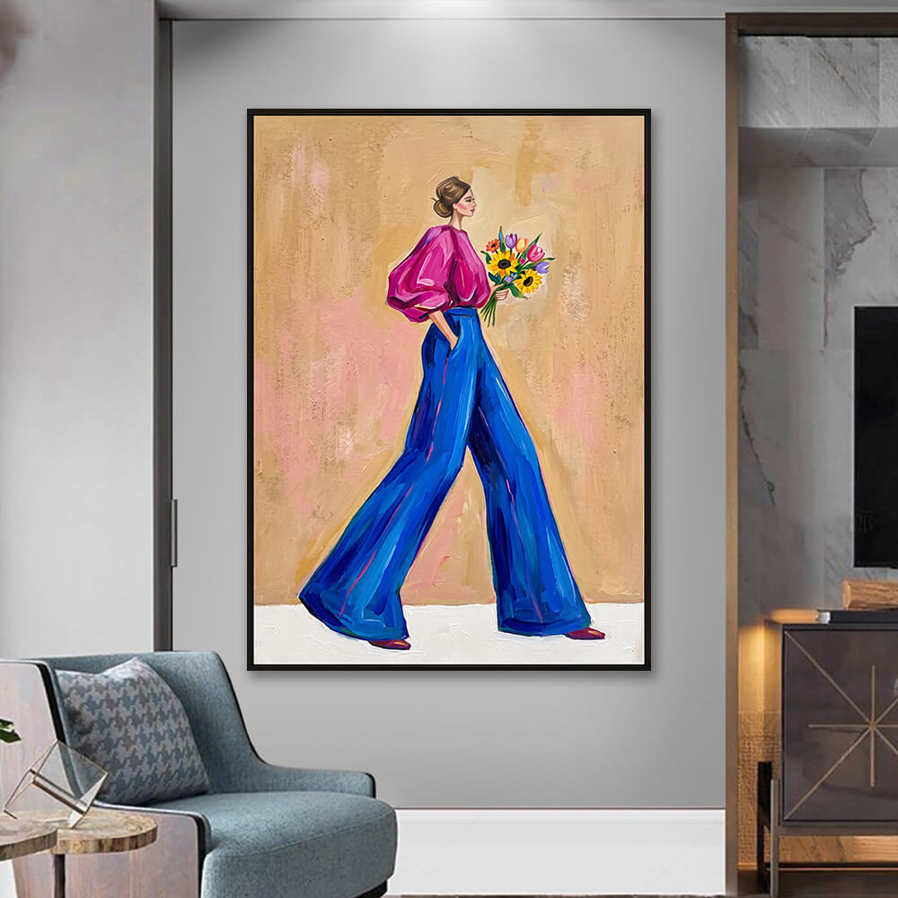 Interior styling view of Vibrant Stride hand painted painting hanging on a light grey wall next to a modern armchair.
