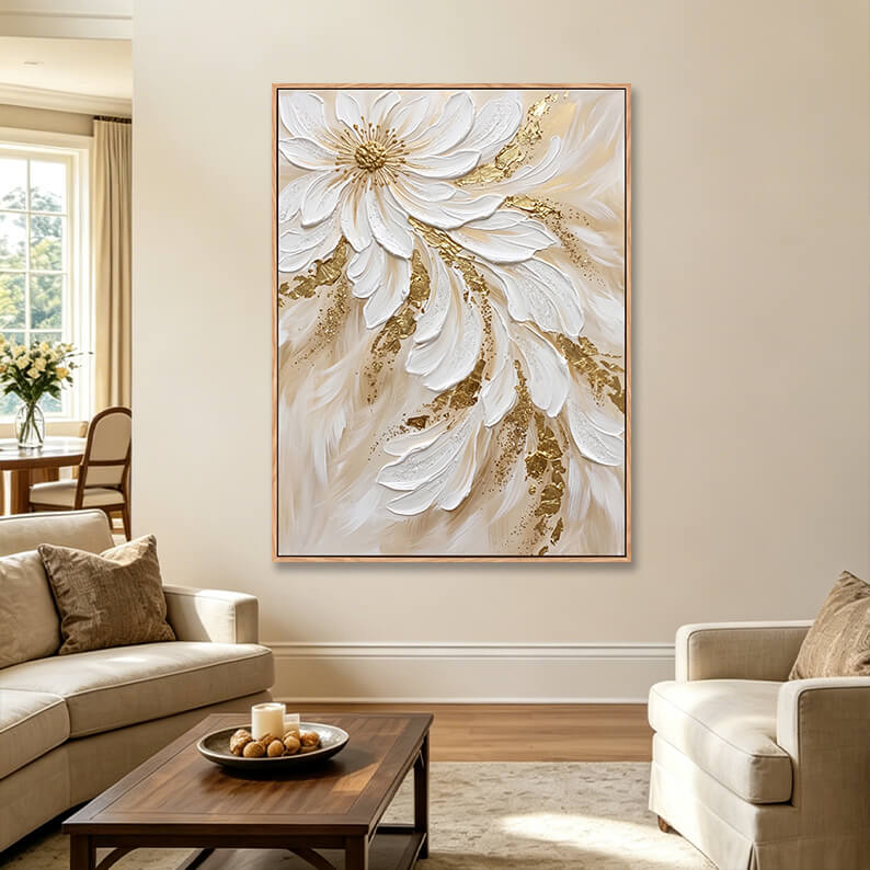 Large vertical textured white flower cascade painting with gold leaf in elegant living room, heavy impasto statement canvas above cream sofa