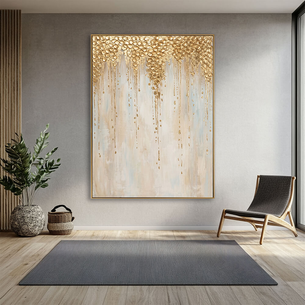 Luxury dripping gold abstract canvas wall art in calm grey modern lounge with wooden accent chair and green foliage plant