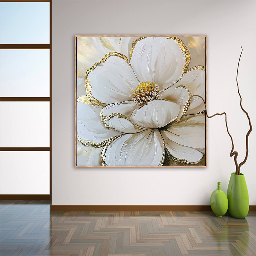 Elegant white magnolia gold leaf canvas wall art hung in minimalist entryway with herringbone wood flooring, glossy green vases and twisted dry branch decor