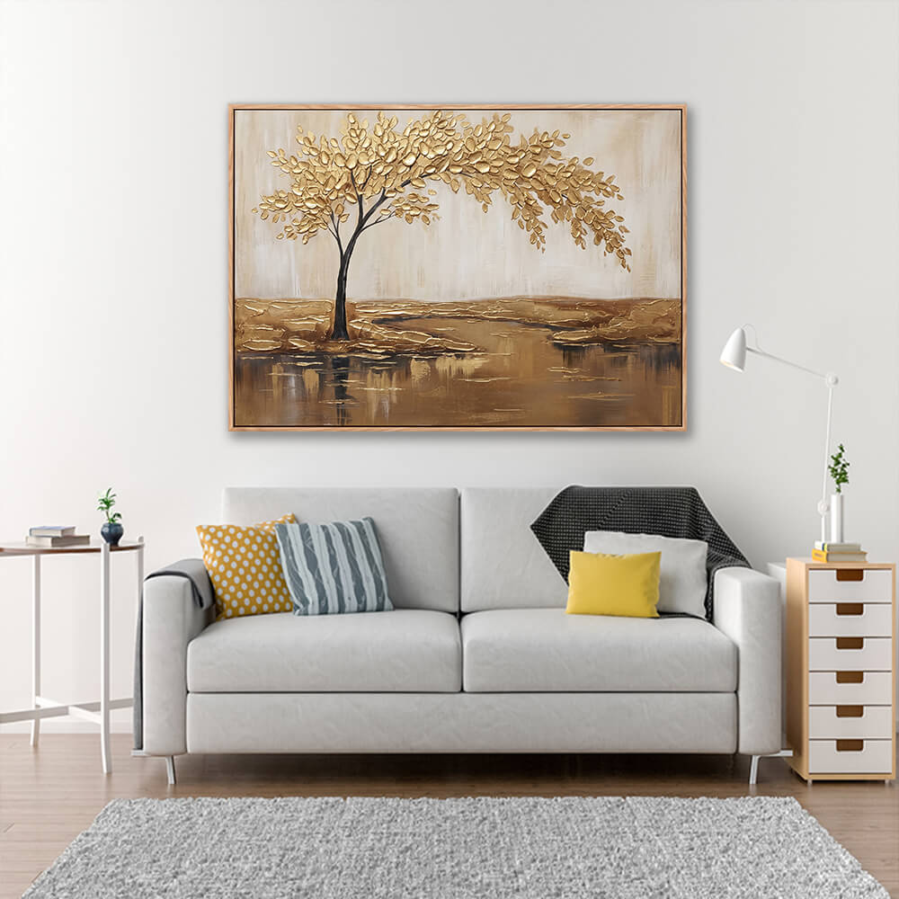 Hand painted golden tree landscape above grey sofa with yellow accent pillows