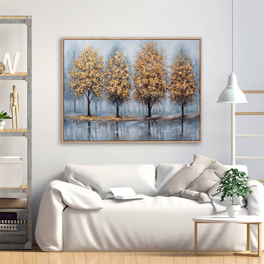 Framed golden trees misty forest painting hanging in modern white living room interior