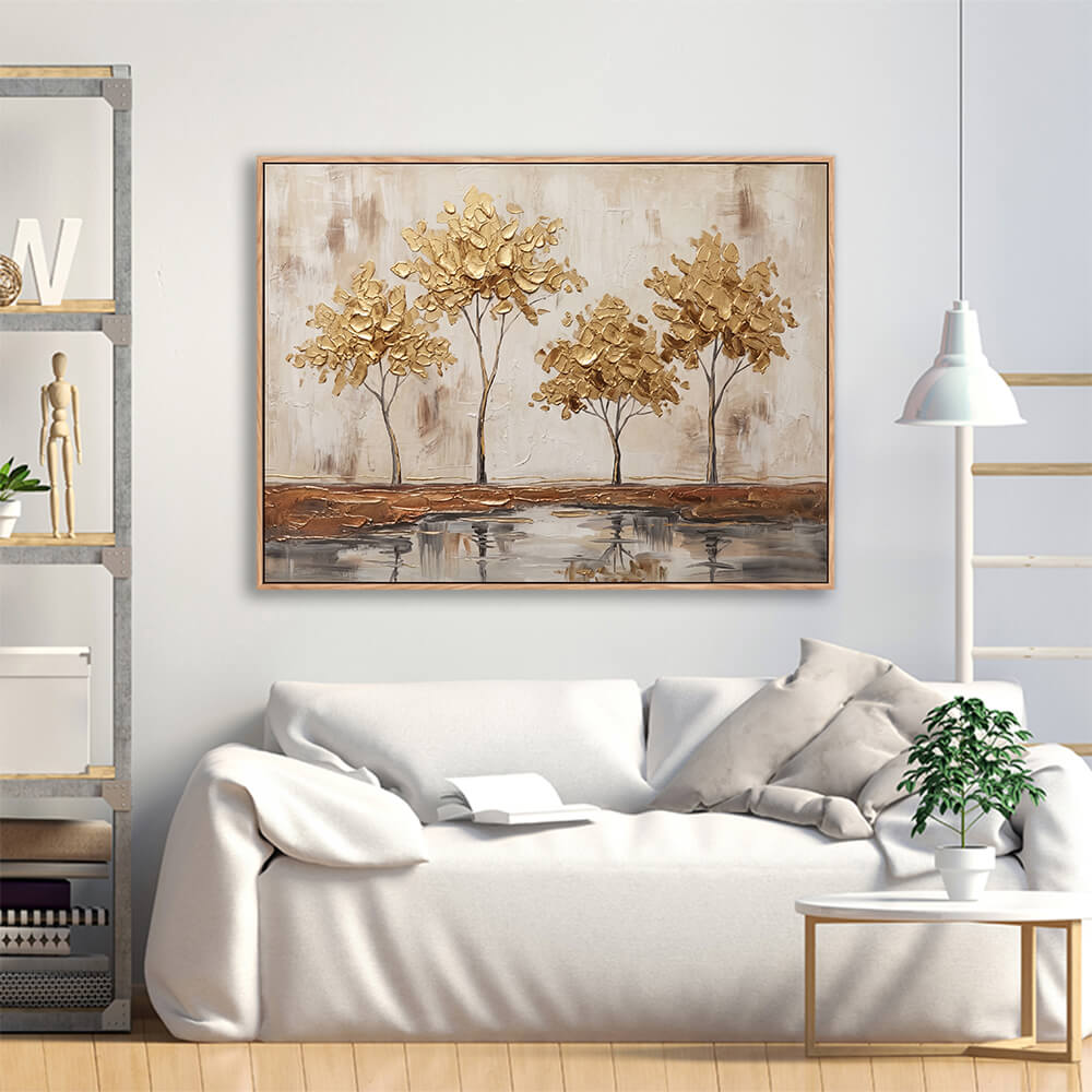 Framed golden trees textured painting hanging in modern white living room interior