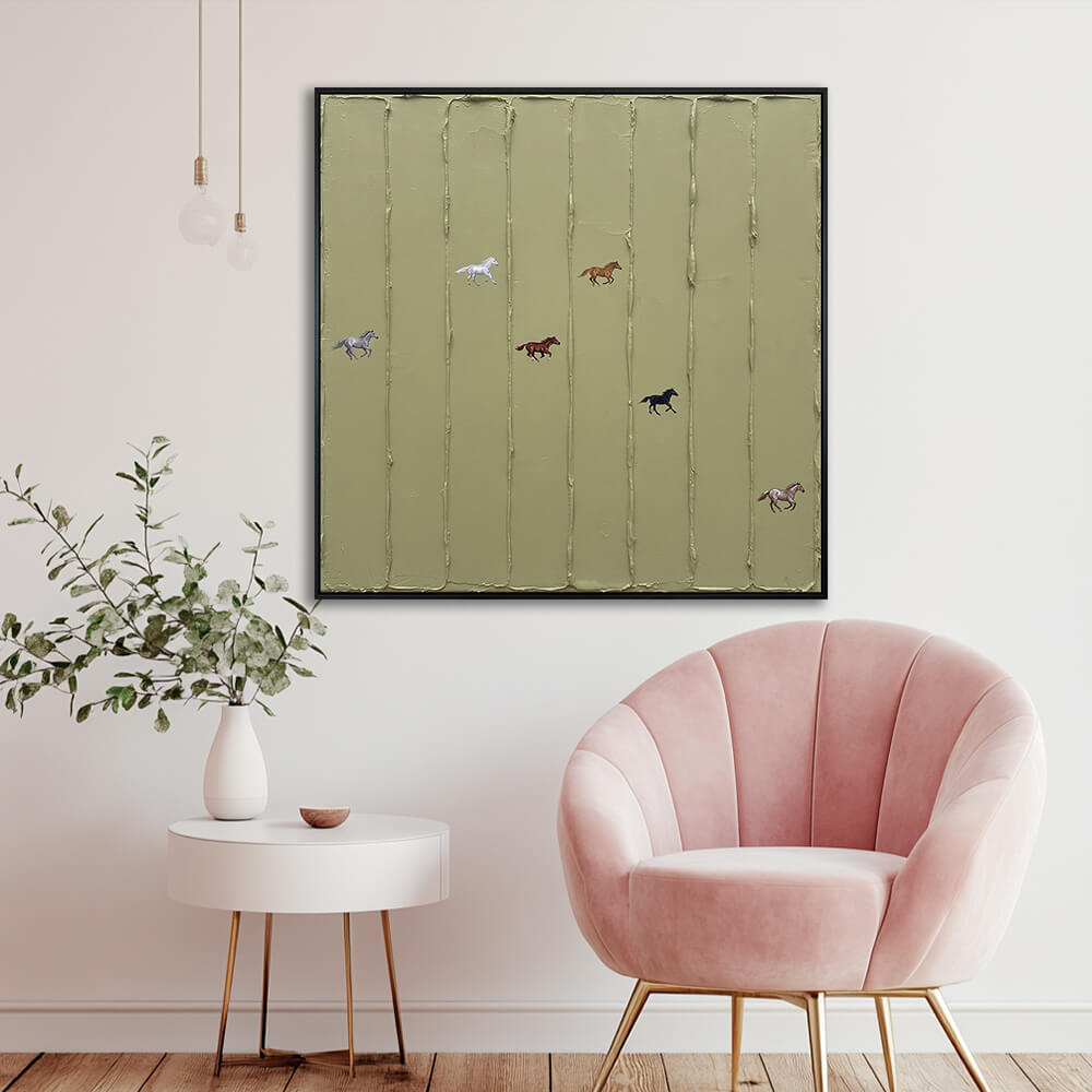 Interior styling view of Wild Meadow Run hanging in a bright minimalist living room next to a pink accent armchair.
