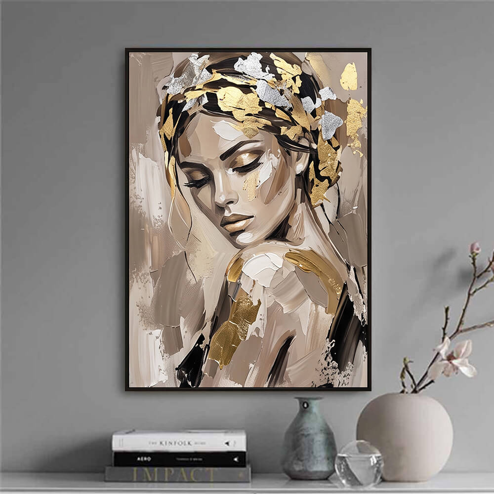 Minimalist decor vignette featuring a framed original canvas painting placed next to a ceramic vase and curated books.