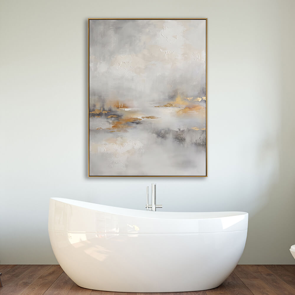 Soft neutral gold leaf abstract canvas mounted above freestanding white bathtub in warm wood spa bathroom