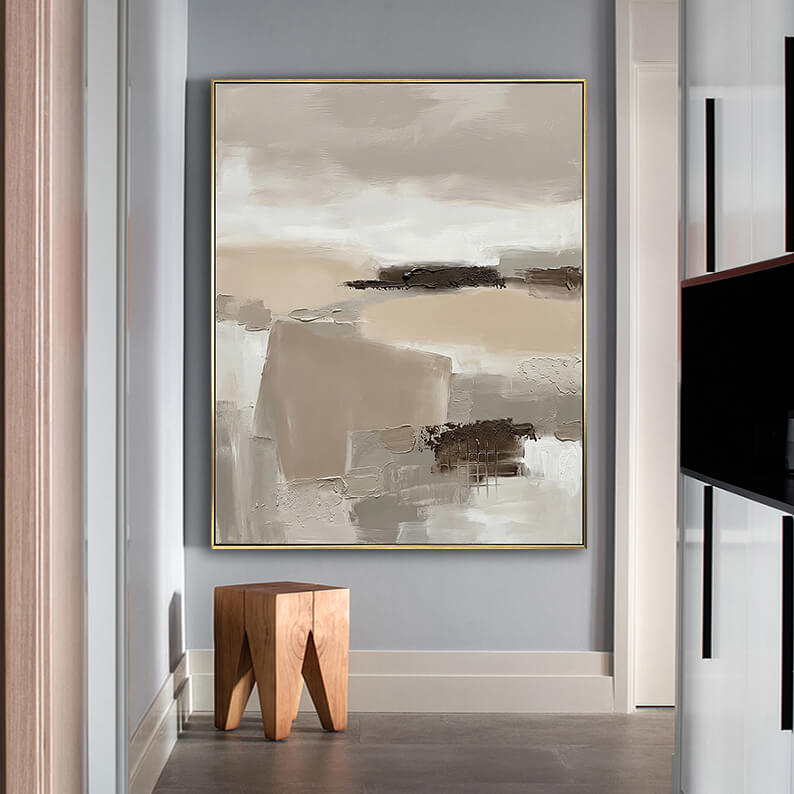 Geometric abstract landscape 3D texture painting hanging above a geometric wooden stool in a minimalist modern hallway.