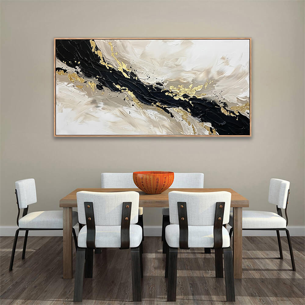 Elegant black and gold sweeping abstract canvas displayed above a wooden dining table with modern chairs.