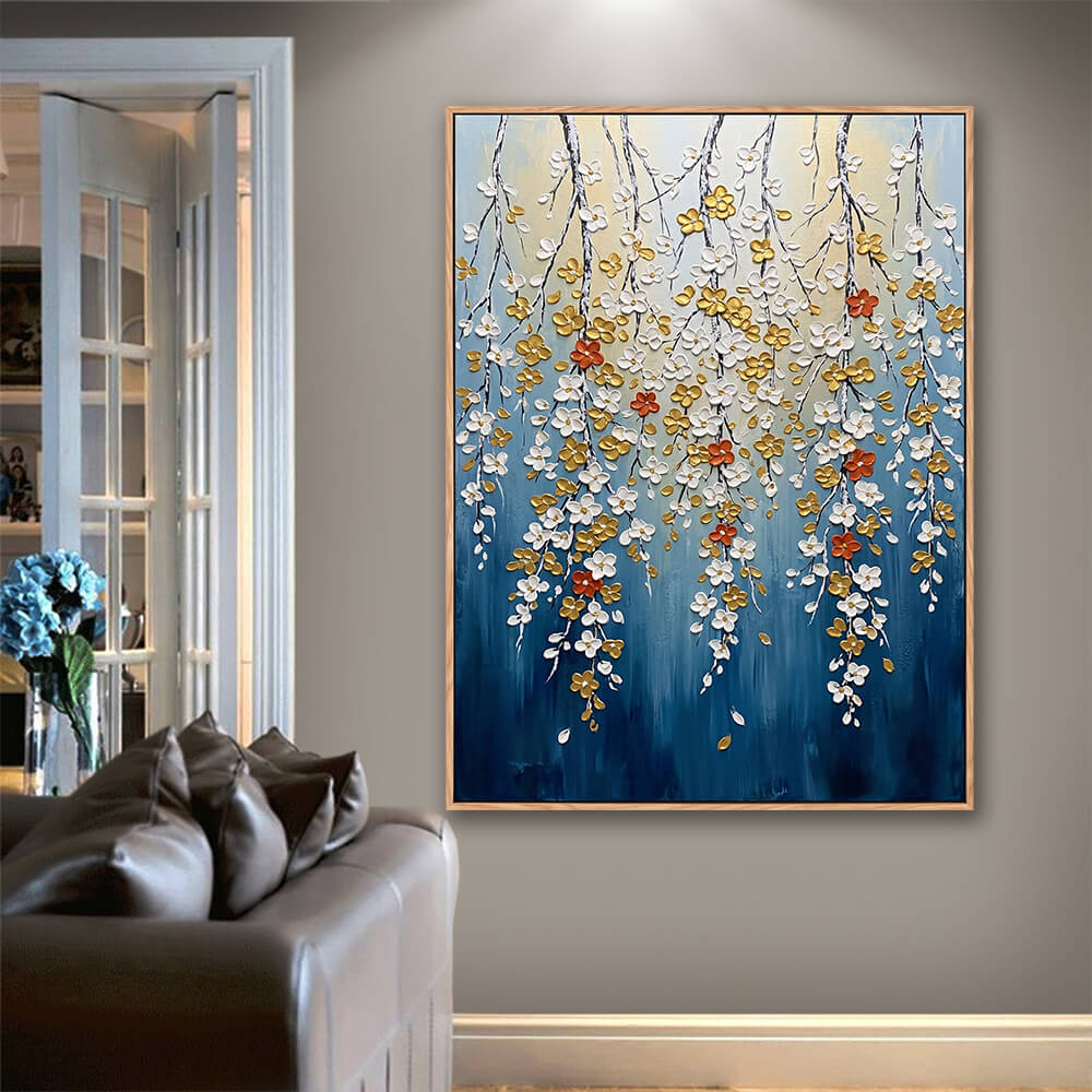 Contemporary living room with leather sofa, vertical impasto hanging floral wall decor, navy blue base sculptural white and golden flowers