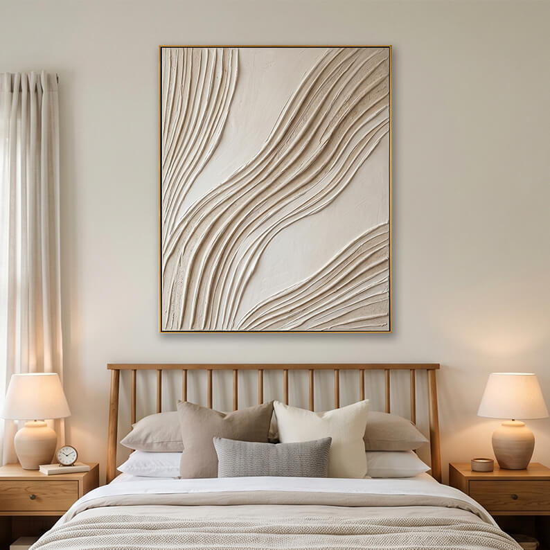 Beige heavy texture wave painting hanging over a wooden bed frame in a bright modern bedroom.