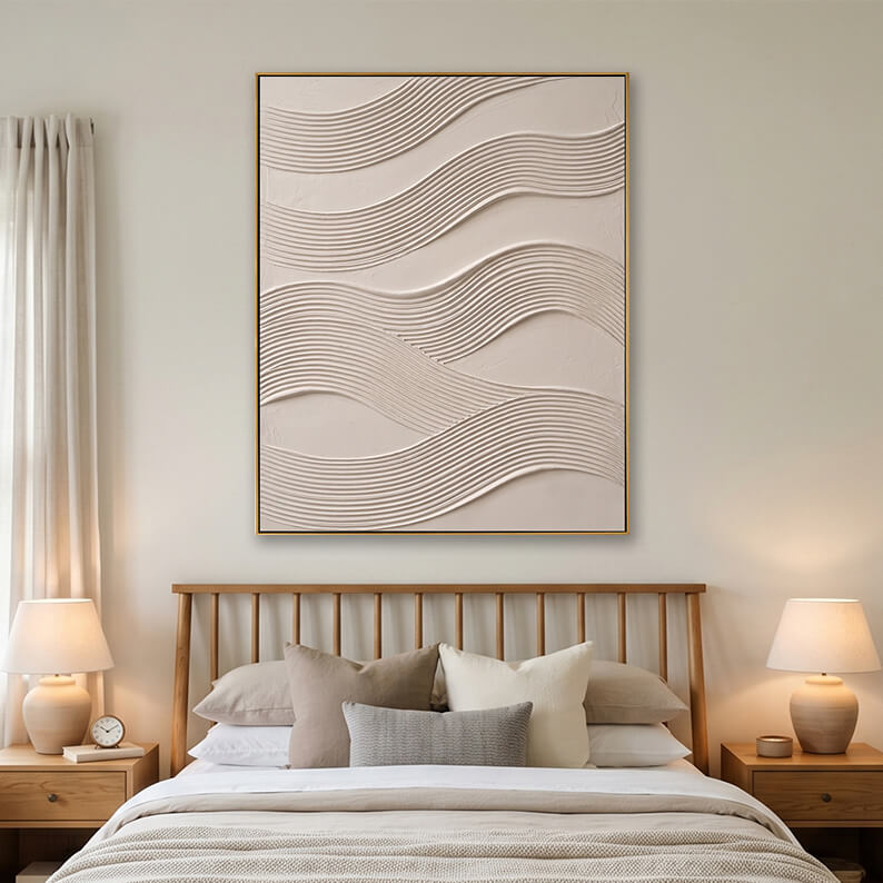 Beige heavy texture ripple wave painting hanging over a wooden bed in a bright modern bedroom.