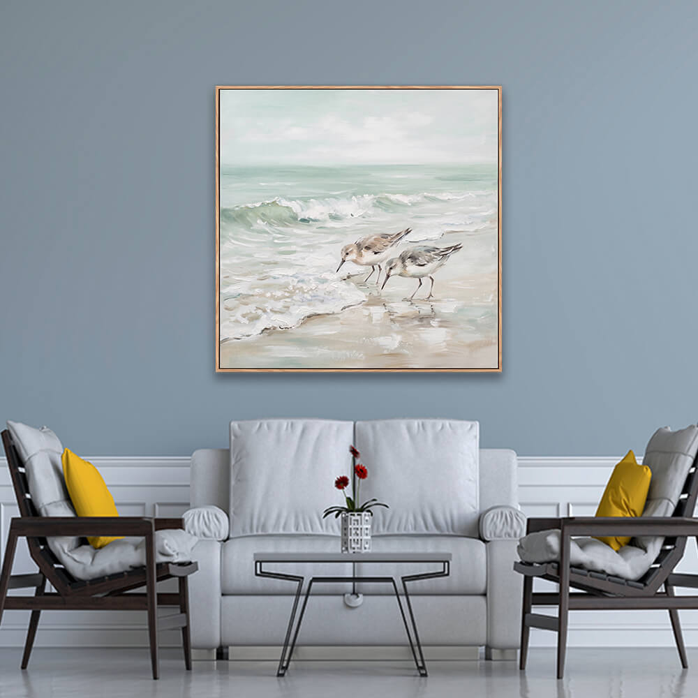 Soft sandpiper shorebird landscape painting on light blue formal living room wall