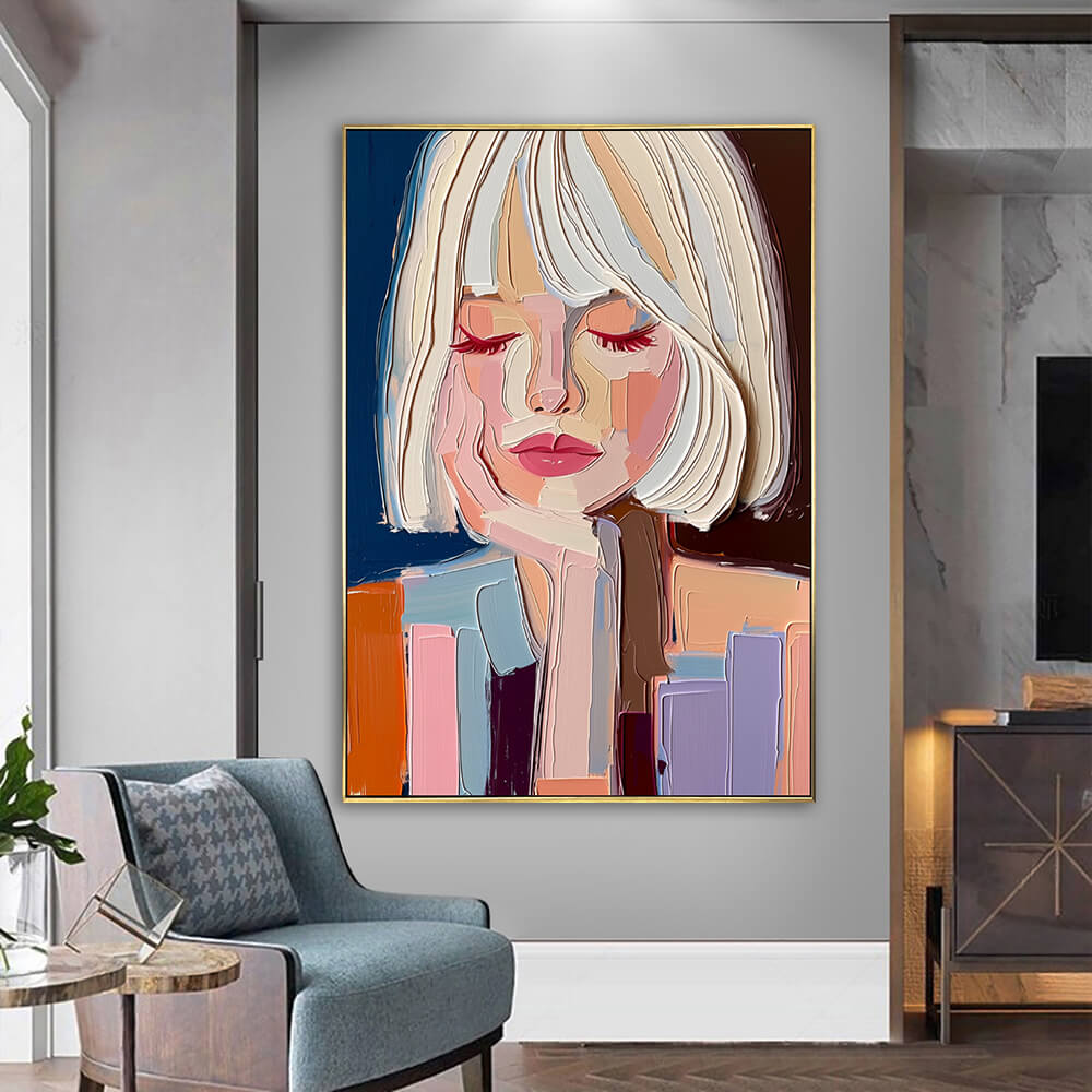 Textured palette knife portrait canvas art hanging on a neutral wall next to a cozy modern armchair and side table.