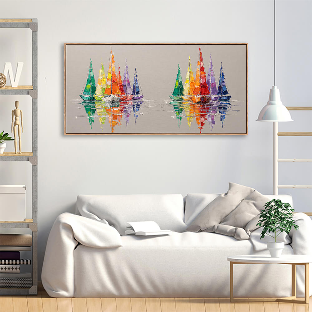 Colorful sailboat reflection seascape canvas hung above soft linen sofa in casual living room