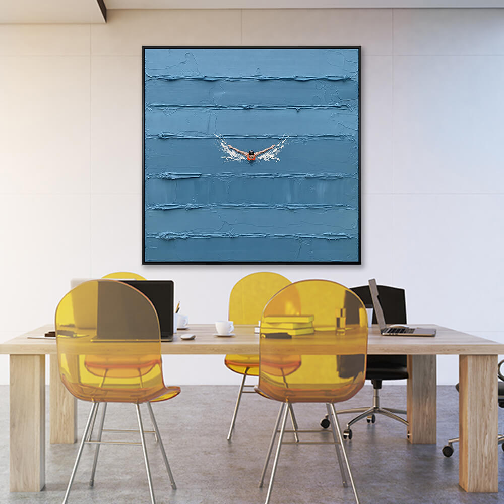 Interior styling view of Solitary Stroke hanging in a modern office above a wooden conference table with yellow chairs.