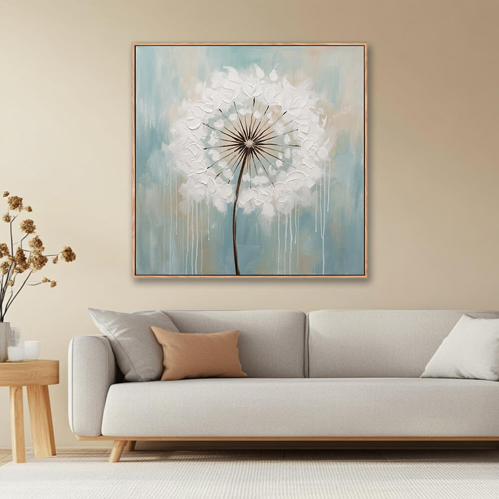 Textured white dandelion floral painting in warm neutral living room with beige sofa