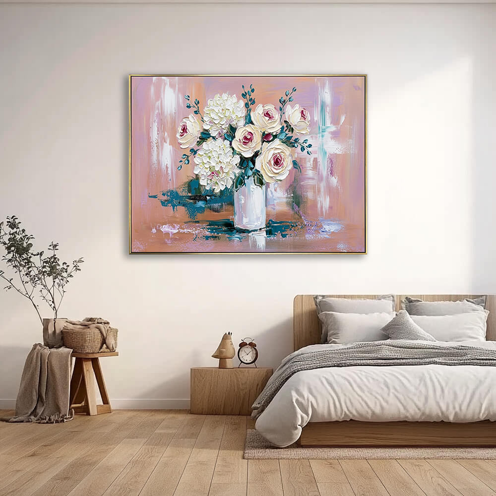 Hand-painted rose hydrangea canvas artwork above light wood bed frame, calm neutral bedroom with warm natural light