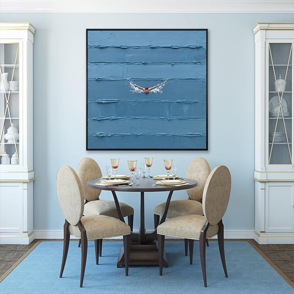 Interior styling view of Solitary Stroke hanging in a blue-walled dining room above a dark wood table set with beige chairs.