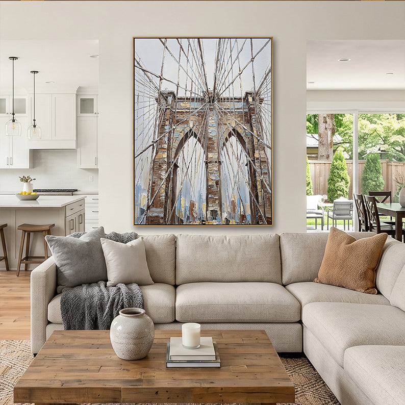Large textured Brooklyn Bridge architectural painting in a modern open-concept living area.