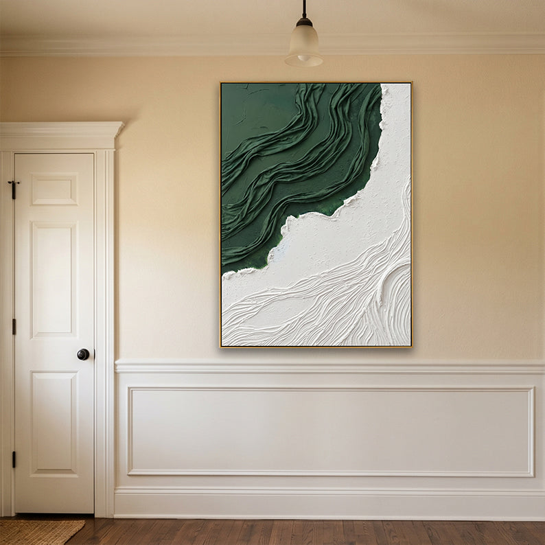Sophisticated hallway with white wainscoting displaying a vertical green and white sculptural canvas.