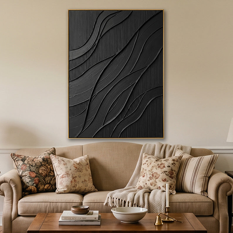 Hand-crafted black canvas art in a cozy, well-lit living room setting.