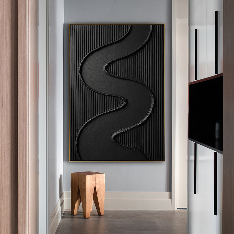 Minimalist black hand-painted wall art with vertical ribbing displayed in a modern gray hallway.