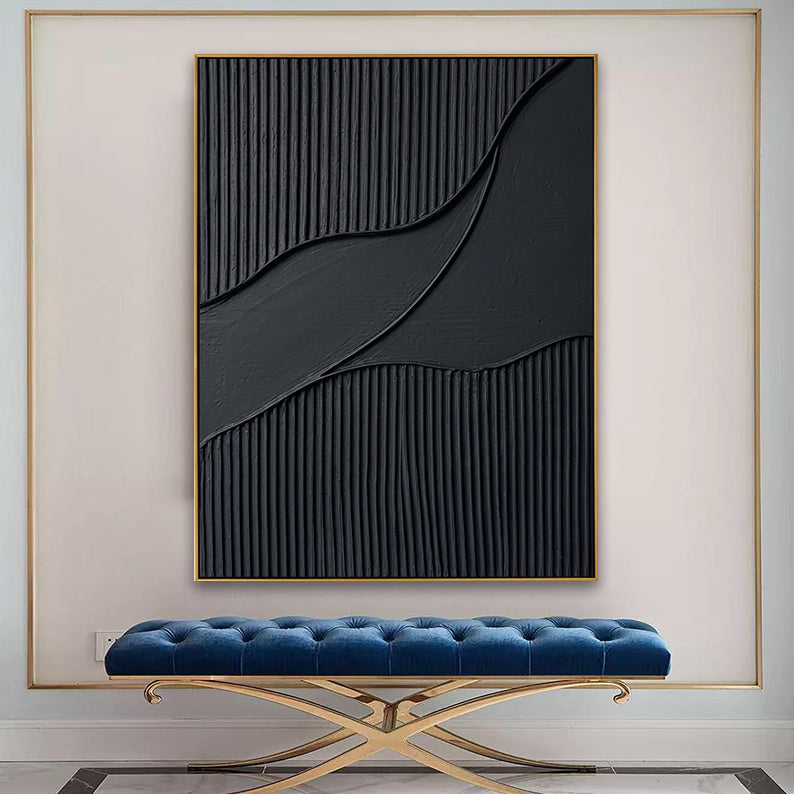 Minimalist black textured painting displayed above a blue velvet bench in a luxury modern entryway.