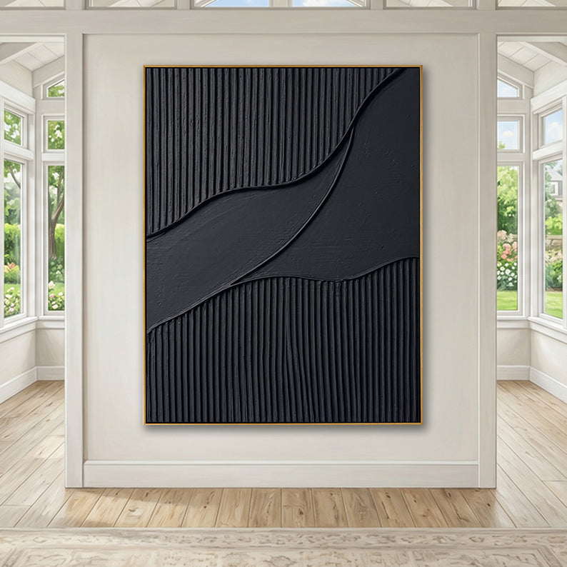 Large black minimalist painting on a white feature wall between large sunlit windows.