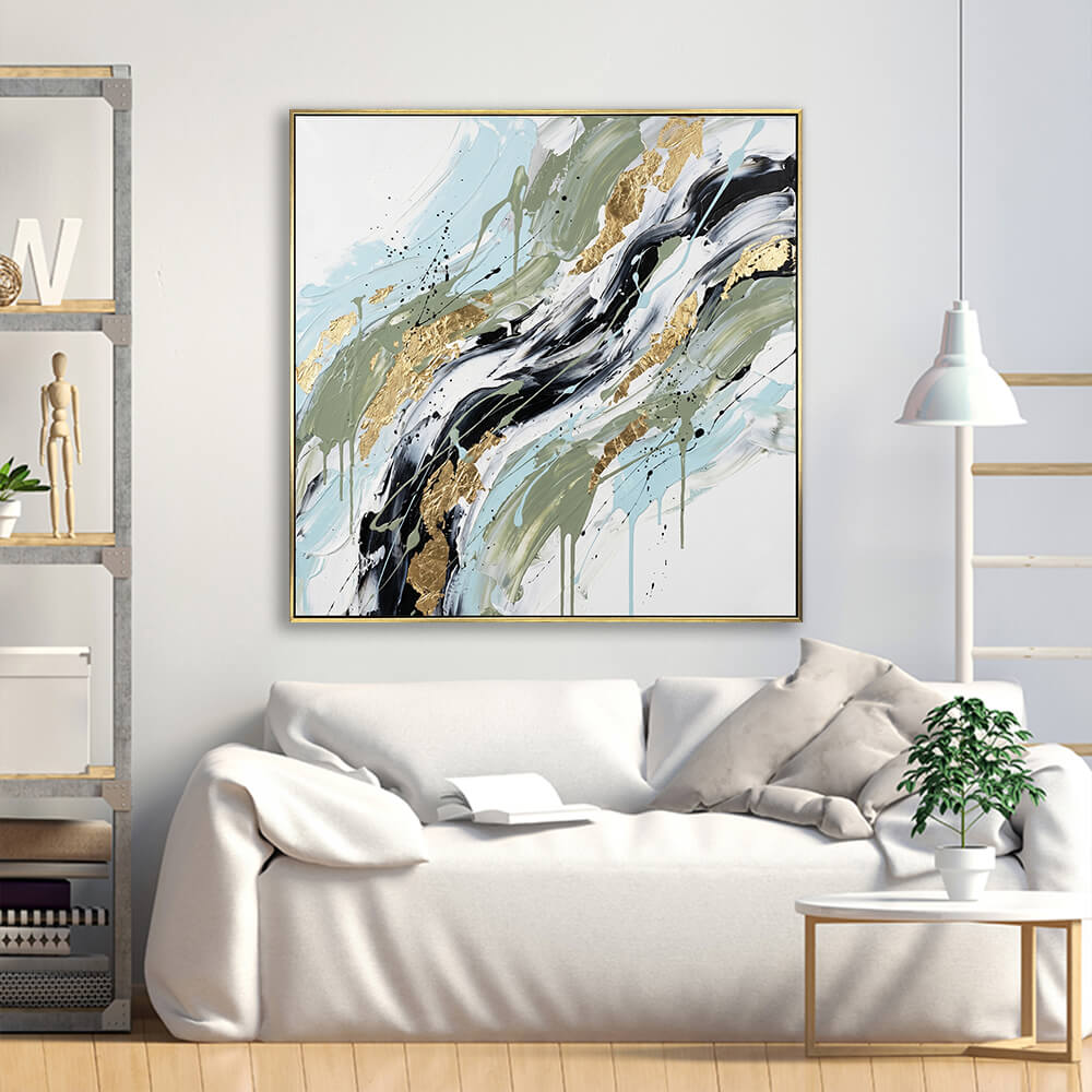 Square impasto gold leaf palette knife canvas hanging over white linen sofa, modern boho living room heavy texture abstract wall decor VisualArti