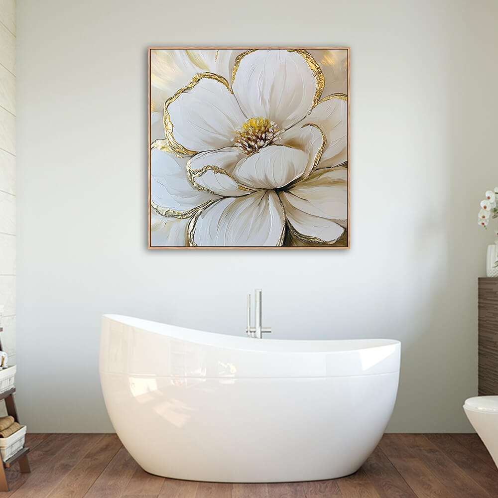 Luxury gold leaf magnolia floral canvas mounted above freestanding white oval bathtub in warm wood spa bathroom