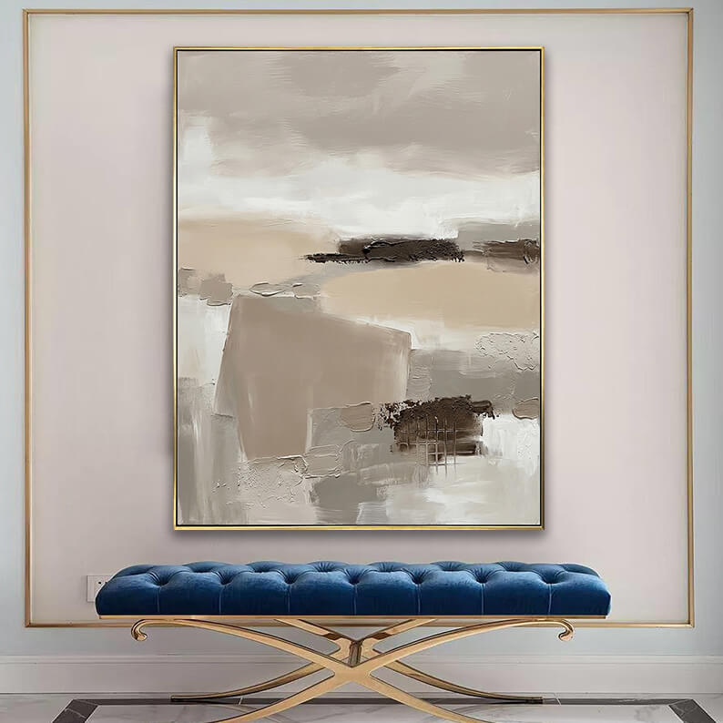 Modern textured landscape canvas art displayed above a tufted blue velvet bench in an elegant entryway.