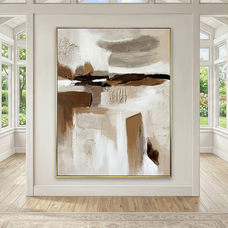 Large hand-painted abstract texture canvas art with dark brown strokes hanging on a wall in a bright sunroom with large windows.